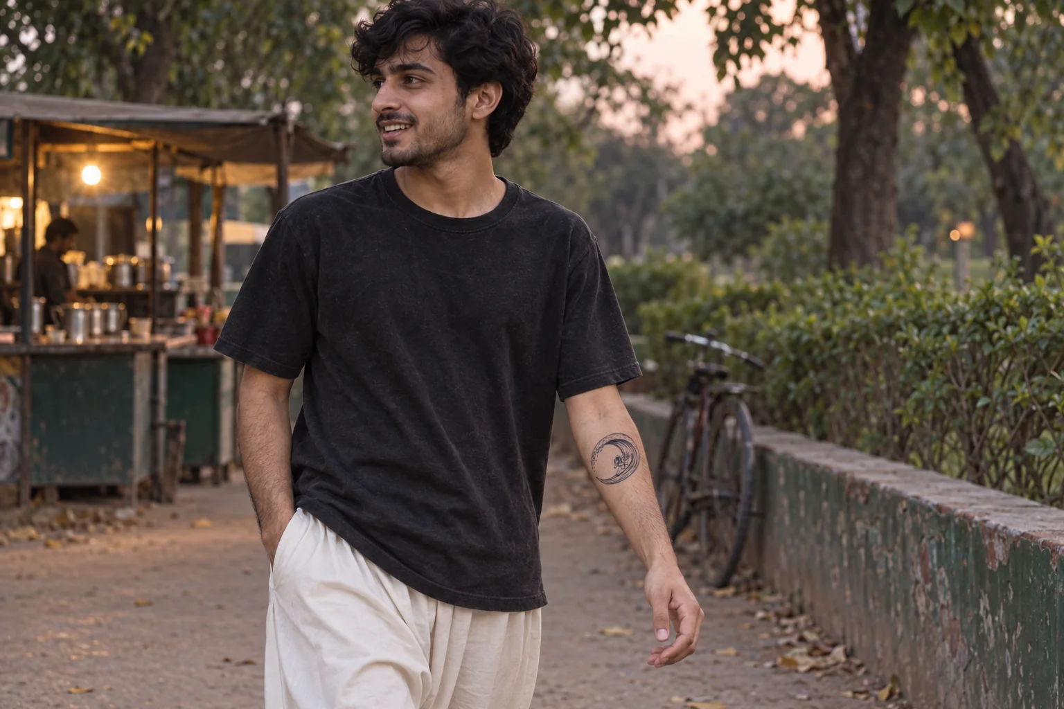 A lunar-wave temporary tattoo worn during an evening park walk